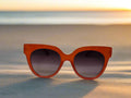 dushi sunset sunglasses front view on beach